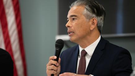 Image of Attorney General Rob Bonta speaking at microphone